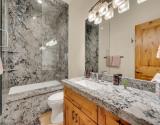 Mid Level Shared Bathroom with Jetted Tub and Shower