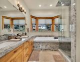 Ensuite - Top Level Featuring A Spa Tub and Separate Shower